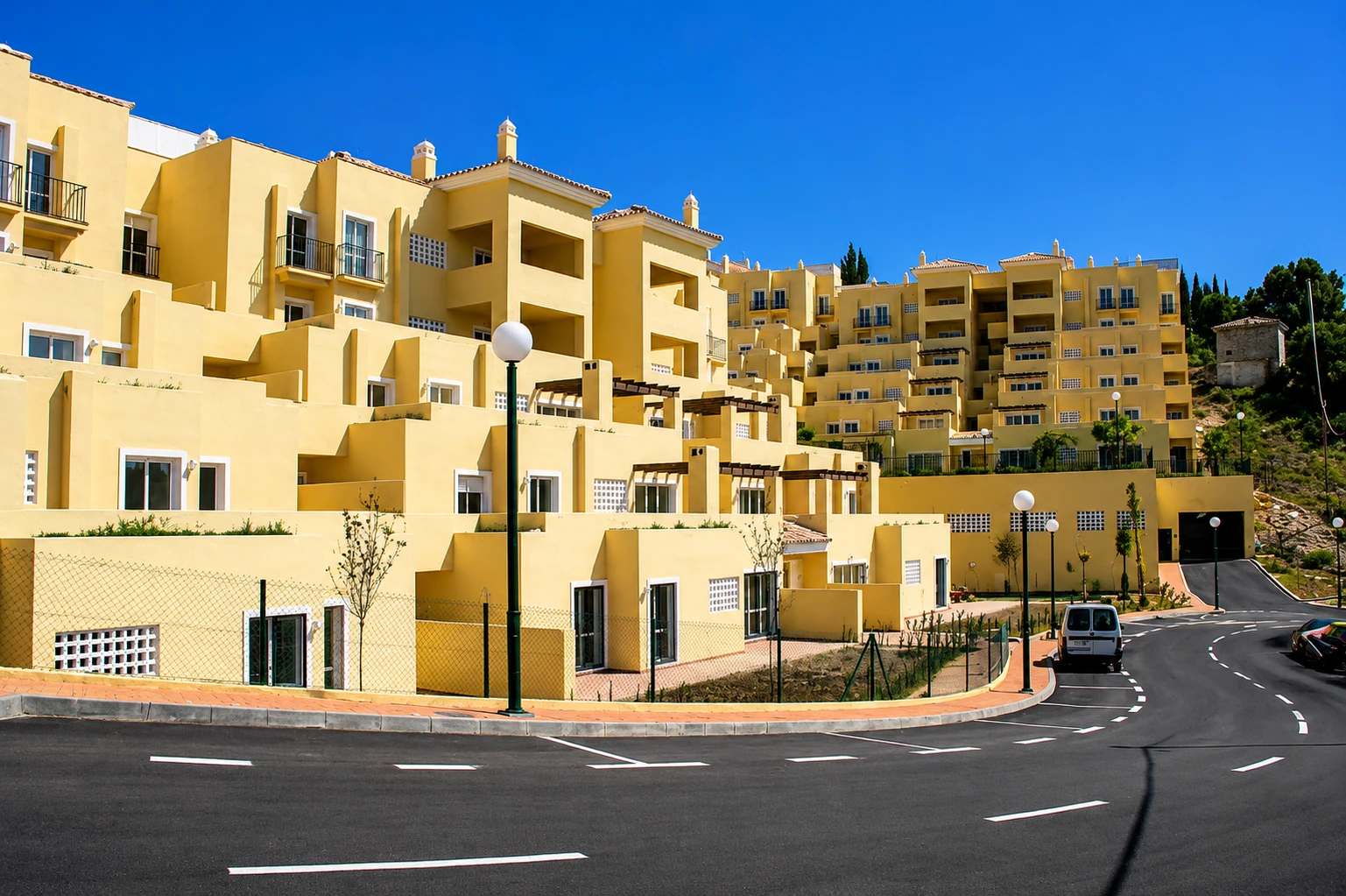 Communal pool in a white urbanisation — Mediterranean tourist architecture from the seventies