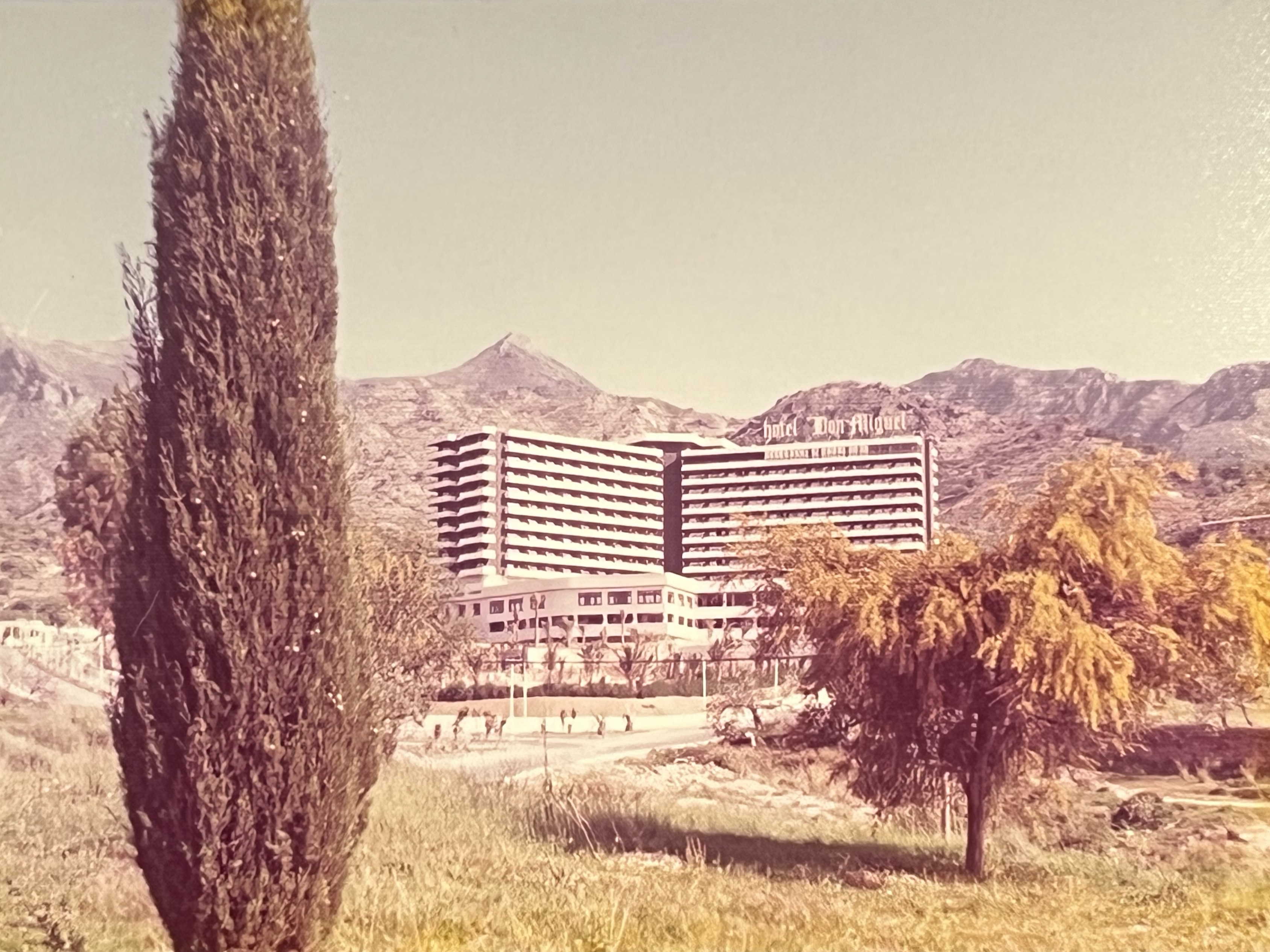 Historic panoramic view of Hotel Don Miguel with mountains behind, Marbella