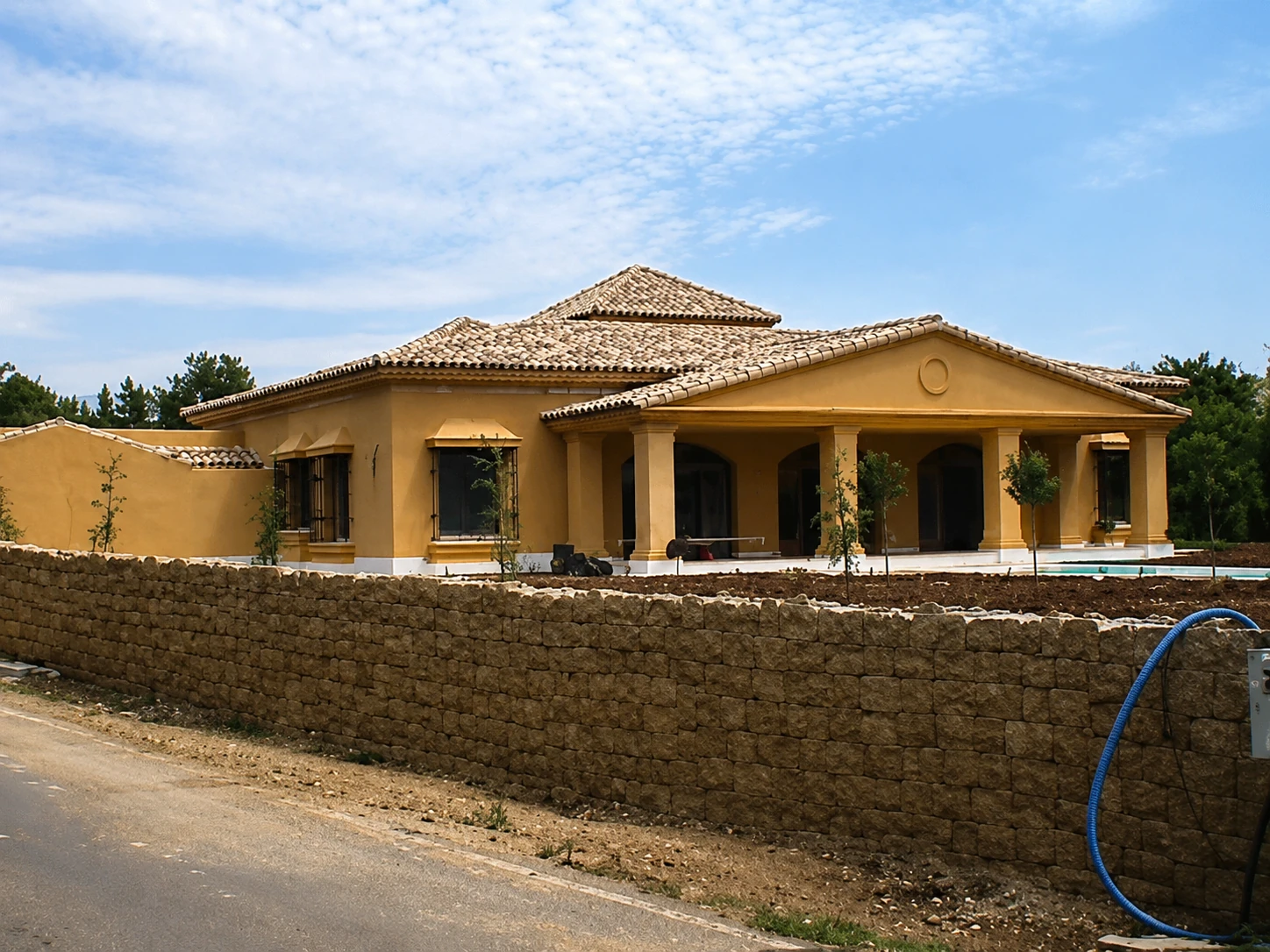 Villa with Columned Portico — Exterior view from the street